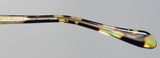 Oliver Peoples Devereaux Eyeglasses frame detail showcasing tortoise pattern and engraving, made in Japan.