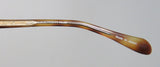 Detail of Oliver Peoples Devereaux Eyeglasses side with 'Made in Japan' engraving.