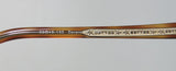 Close-up of the Oliver Peoples Devereaux Eyeglasses frame showing the engraved details and size markings.