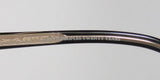 Detail of Oliver Peoples Devereaux Eyeglasses frame showing engraved logo and design features.