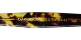 Close-up of the Garrett Leight Oakwood Blue Light Technology Eyeglasses temple with logo details.