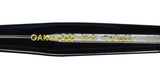 Close-up of the Garrett Leight Oakwood Blue Light Technology Eyeglasses frame featuring logo details.