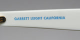 Garrett Leight Gl 3030 Sunglasses detail showing the brand label on the temple in blue text.