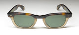Garrett Leight designer sunglasses front view with green lenses and tortoiseshell frame.