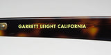 Close-up of the logo on Garrett Leight Lo-B Sunglasses in tortoise shell design.